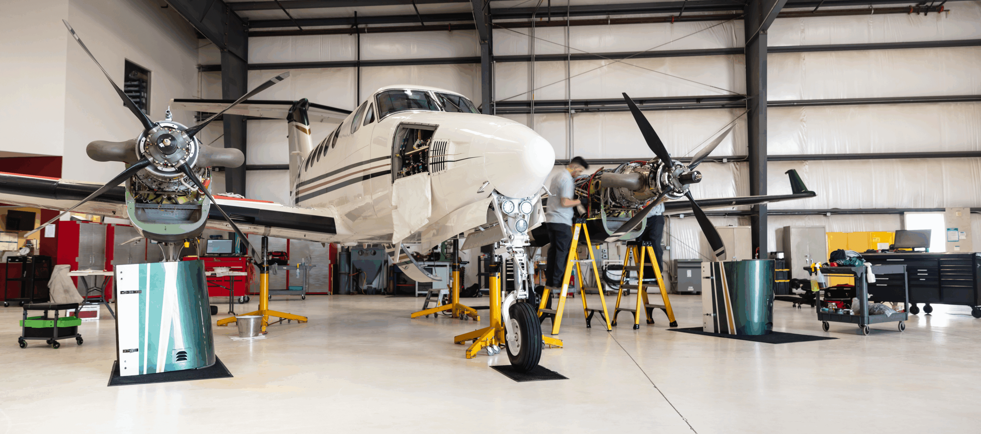 Airplane undergoing maintenance in hangar